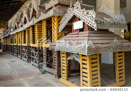 Line of Decorative home models at Buddhist temple The Shwezigon Pagoda or Shwezigon Paya, Nyaung-U, Bagan Myanmar. Line of Decorative home models at Buddhist temple The Shwezigon Pagoda or Shwezigon Paya, Nyaung-U, Bagan Myanmar. 69849133