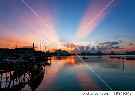 Longtail boat with coastal fishing village,Beautiful scenery view in morning sunrise over sea and mountain at phang - nga thailand. 69849348
