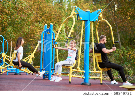Active family time at the outdoor gym Active family time at the outdoor gym 69849721
