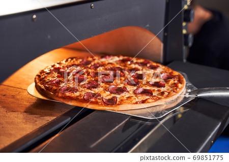 Baking tasty italian pizza concept 69851775