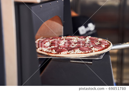 Baking tasty italian pizza concept Baking tasty italian pizza concept 69851780
