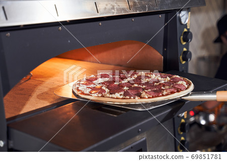 Baking tasty italian pizza concept Baking tasty italian pizza concept 69851781