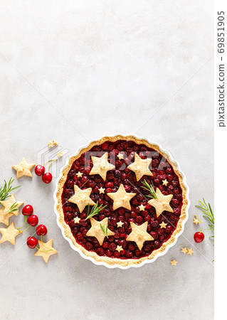 Homemade cherry pie, tart with star shaped cookies Homemade cherry pie, tart with star shaped cookies 69851905
