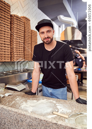 Pizzaiolo with beard making a Pizza Pizzaiolo with beard making a Pizza 69851906