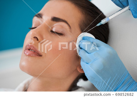 Girl doing beauty injection Girl doing beauty injection 69852682