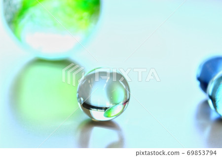 Many marbles illuminated by light Many marbles illuminated by light 69853794