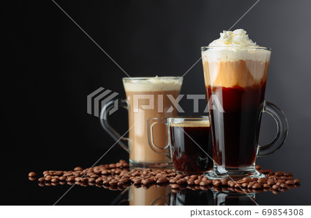 Various coffee drinks on a black background. Various coffee drinks on a black background. 69854308