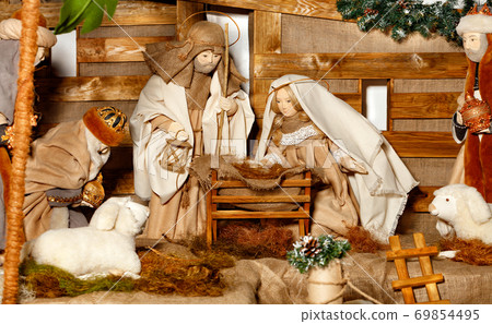Puppet composition of the Nativity of Christ with the Jesus, Virgin Mary, Joseph, a manger, straw and the Magi who came. Puppet composition of the Nativity of Christ with the Jesus, Virgin Mary, Joseph, a manger, straw and the Magi who came. 69854495