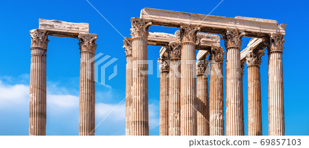 Panoramic view of Corinthian columns of Olympian Zeus temple on sky background, Athens, Greece. Panoramic view of Corinthian columns of Olympian Zeus temple on sky background, Athens, Greece. 69857103