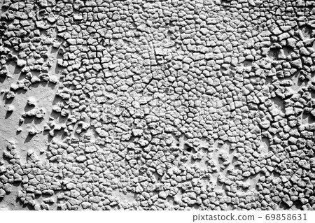 Surface of the old metal wall is covered with a lot of cracks. Destruction of the old cracked paint. 69858631