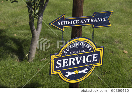 Tin sign on the lawn Tin sign on the lawn 69860410