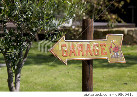 Tin sign on the lawn Tin sign on the lawn 69860413