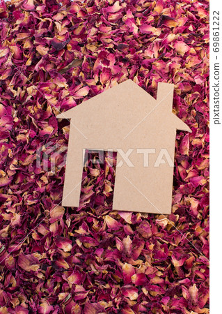 Paper house on dry rose petals Paper house on dry rose petals 69861222
