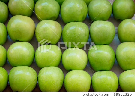 Green apples in a market place Green apples in a market place 69861320