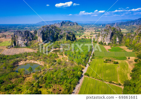 Aerial view of Limestone mountain and rice field Aerial view of Limestone mountain and rice field 69861681