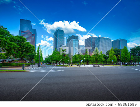 Modern building on blue sky background with road 69861689
