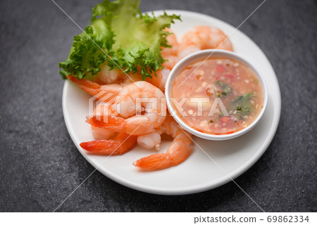 Shrimp delicious seasoning spices on white plate appetizing cooked boiled shrimps prawns , salad shelfish seafood sauce / Shrimp delicious seasoning spices on white plate appetizing cooked boiled shrimps prawns , salad shelfish seafood sauce / 69862334
