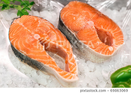 Salmon Red Fish Steak at the fish market. Raw fresh steaks of Salmon fish as background. 69863069