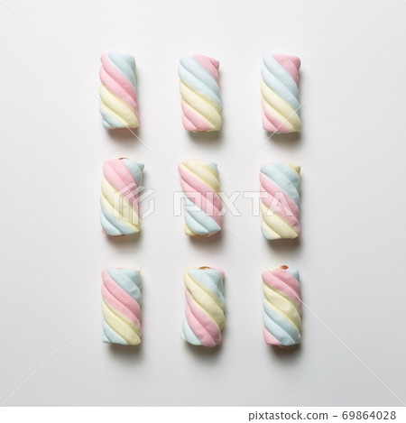 Colorful marshmallow on white background. flat lay, top view. Delicious snacks pattern background Colorful marshmallow on white background. flat lay, top view. Delicious snacks pattern background 69864028