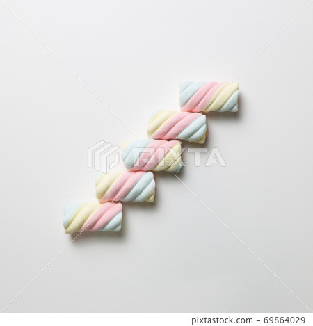Stairs. Colorful marshmallow on white background. flat lay, top view Stairs. Colorful marshmallow on white background. flat lay, top view 69864029