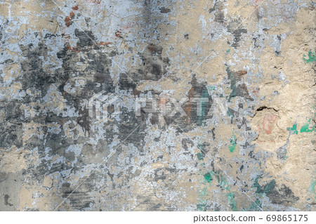 Texture, background of the old wall and with damaged cladding Texture, background of the old wall and with damaged cladding 69865175