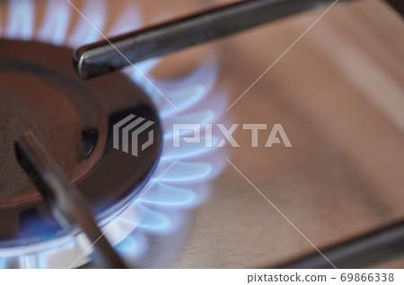 Blue gas stove fire macro close up view Blue gas stove fire macro close up view 69866338