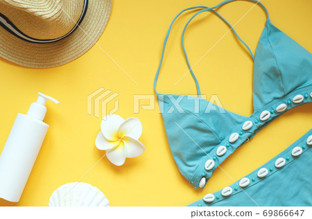 set of summer beach accessories on a yellow background set of summer beach accessories on a yellow background 69866647