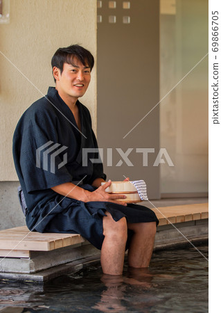 Men taking a footbath Men taking a footbath 69866705
