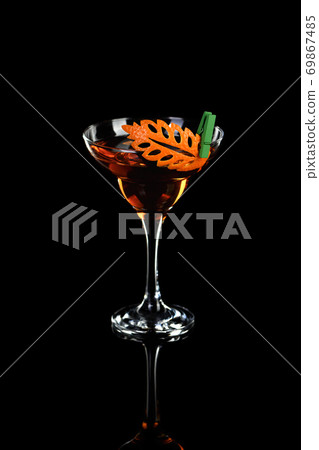 Cocktail Rob Roy . Art in orange- fruits carving. Cocktail Rob Roy . Art in orange- fruits carving. 69867485
