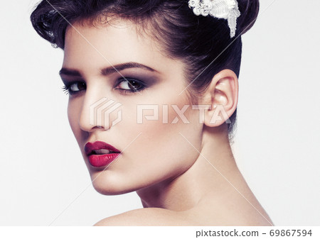 Beautiful model wearing hair wedding accessories Beautiful model wearing hair wedding accessories 69867594