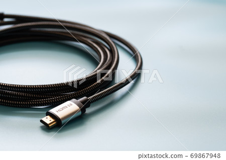 HDMI Cable connector and copy space on blue background color mood and tone style HDMI Cable connector and copy space on blue background color mood and tone style 69867948