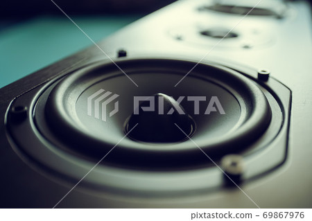 Closeup of black premium loudspeaker for music and home theater system with color mood and tone style Closeup of black premium loudspeaker for music and home theater system with color mood and tone style 69867976
