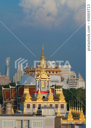 Loha Prasat Wat Ratchanatda and Golden Mountain pagoda, a buddhist temple or Wat Saket with skyscraper buildings in Bangkok Downtown, urban city, Thailand. Thai Landmark. Architecture. 69869713