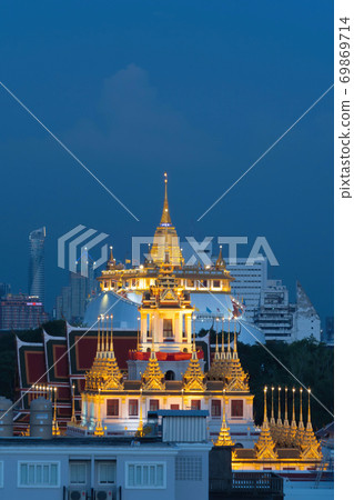 Loha Prasat Wat Ratchanatda and Golden Mountain pagoda, a buddhist temple or Wat Saket with skyscraper buildings in Bangkok Downtown, urban city, Thailand. Thai Landmark. Architecture. 69869714