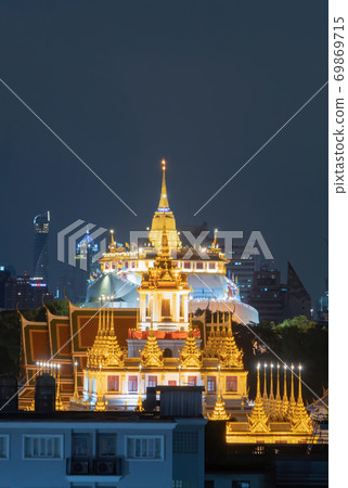 Loha Prasat Wat Ratchanatda and Golden Mountain pagoda, a buddhist temple or Wat Saket with skyscraper buildings in Bangkok Downtown, urban city, Thailand. Thai Landmark. Architecture. 69869715