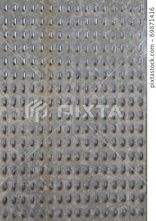 Vertical image of a sheet of perforated metal. Vertical image of a sheet of perforated metal. 69871416