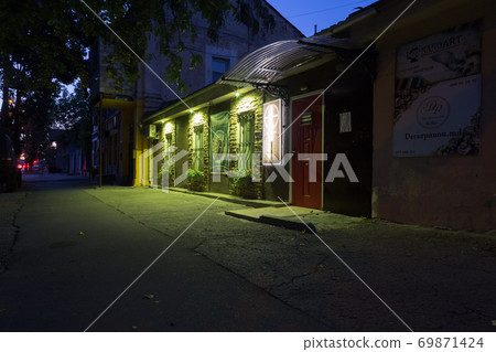 An old building illuminated by green light. An old building illuminated by green light. 69871424