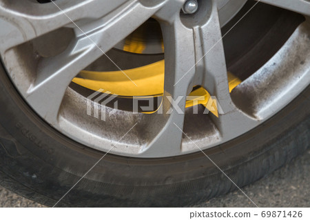 A golden rey of sun stuck in the wheel. A golden rey of sun stuck in the wheel. 69871426