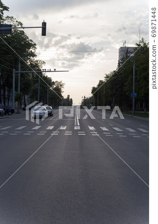 The central street of the city after suncet. 69871448