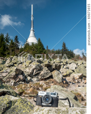 Minolta analog camera and Jested mountain. Minolta analog camera and Jested mountain. 69871655