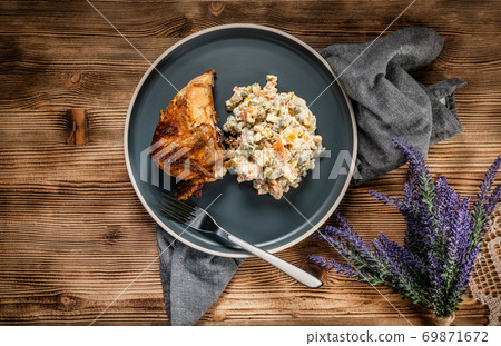 Roast chicken served with russian traditional salad. 69871672