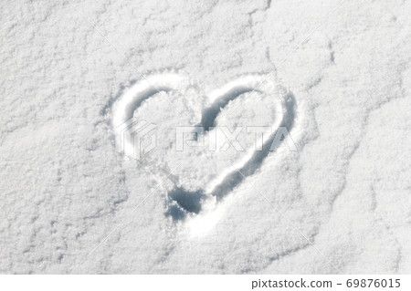 Heart drawn on snow background sunny winter day. Heart drawn on snow background sunny winter day. 69876015
