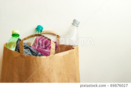 Empty used plastic bottles, bags in brown paper Empty used plastic bottles, bags in brown paper 69876027