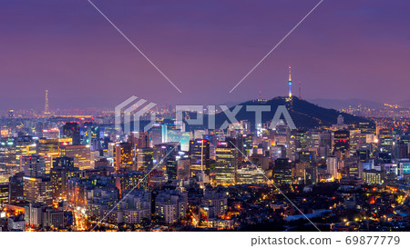 Downtown cityscape at night in Seoul, South Korea. 69877779