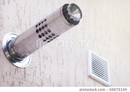 Munich plaster wall with gas chimney and ventilation hole Munich plaster wall with gas chimney and ventilation hole 69878184