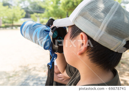 Children drinking tea in a water bottle Children drinking tea in a water bottle 69878741