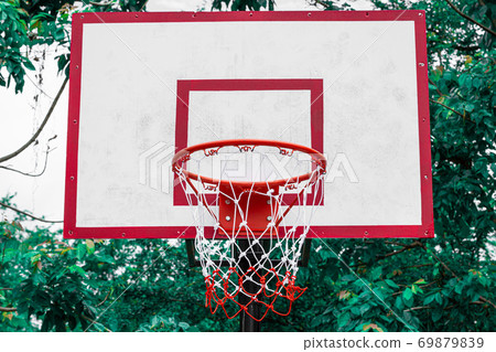 Basket ball net on a green natural background Basket ball net on a green natural background 69879839