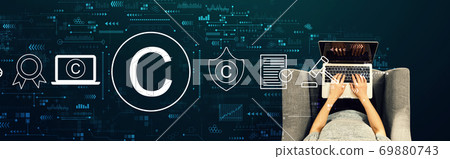 Copyright concept with person using a laptop 69880743