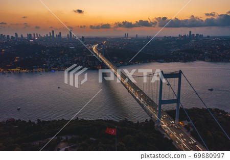 Istanbul Bosphorus Bridge at Dusk Sunset with Car traffic jam and City Skyline, Aerial View Istanbul Bosphorus Bridge at Dusk Sunset with Car traffic jam and City Skyline, Aerial View 69880997