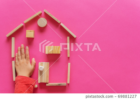 A home made of wooden pegs, blocks and circles A home made of wooden pegs, blocks and circles 69881227